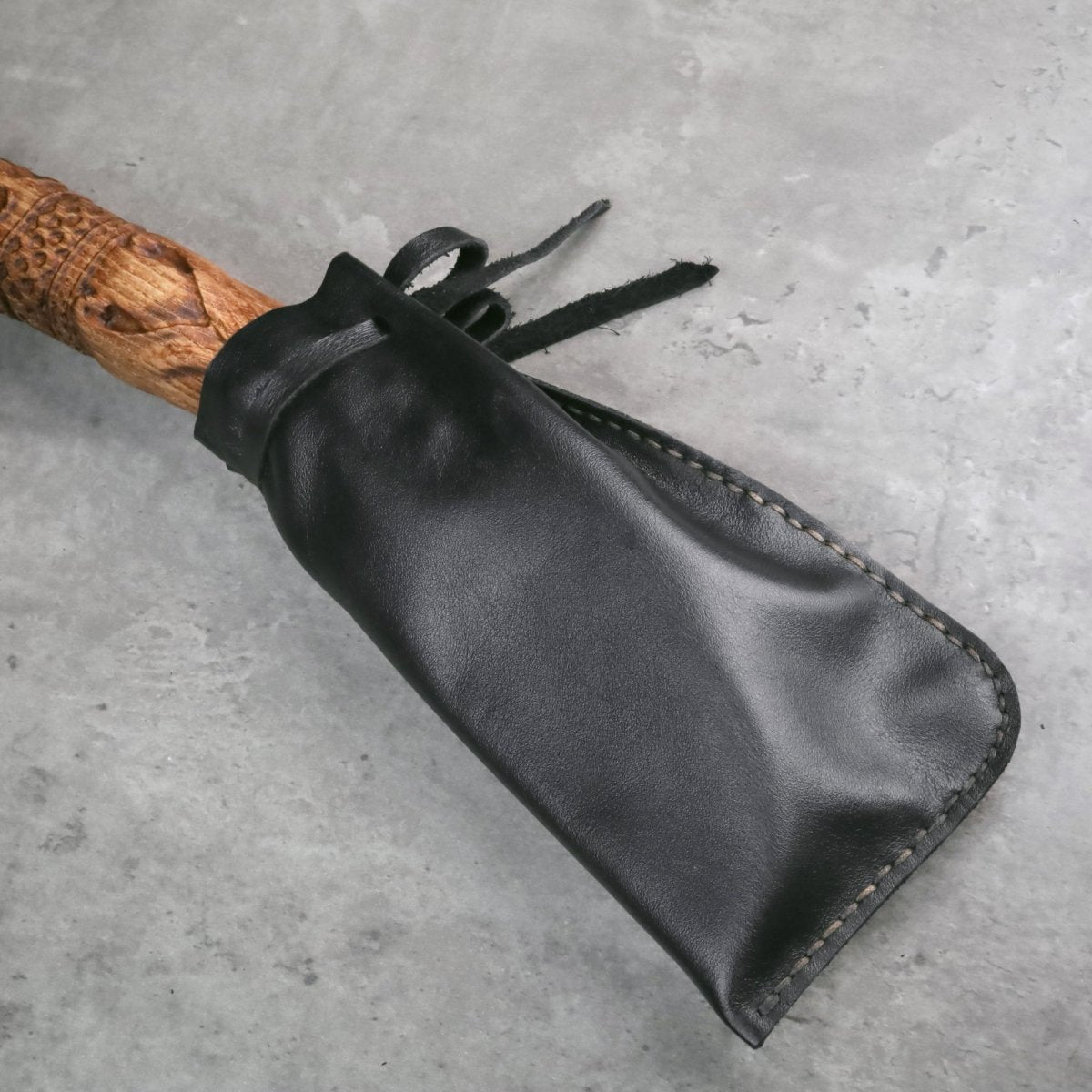 Handcrafted Leviathan axe with leather cover and glow in the dark runes from AncientSmithy