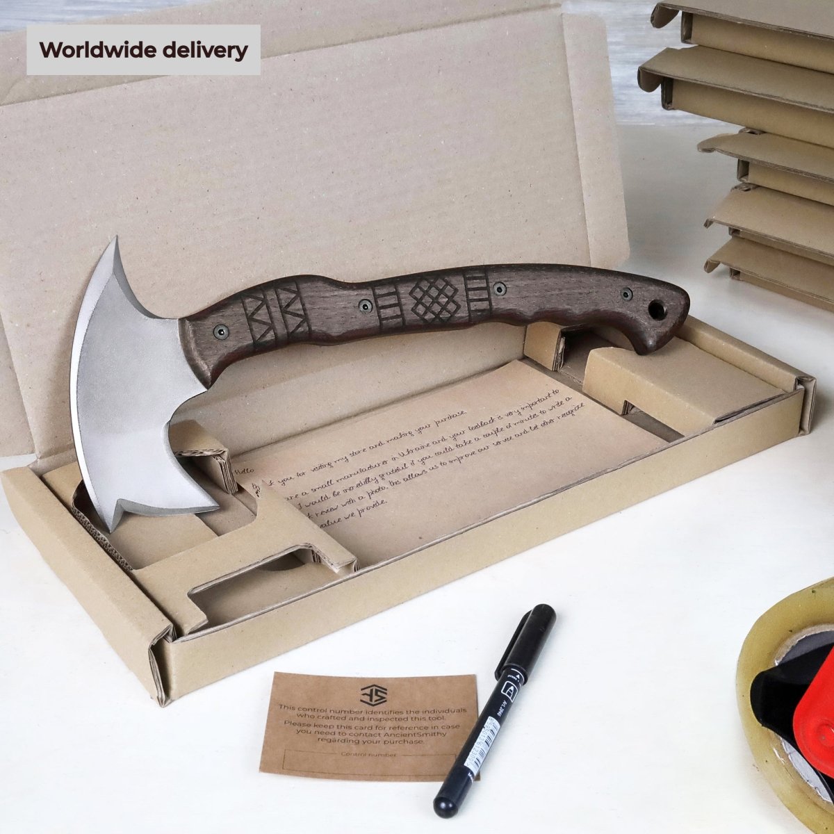 Handcrafted tomahawk "Takoda" with tribal engraving from AncientSmithy