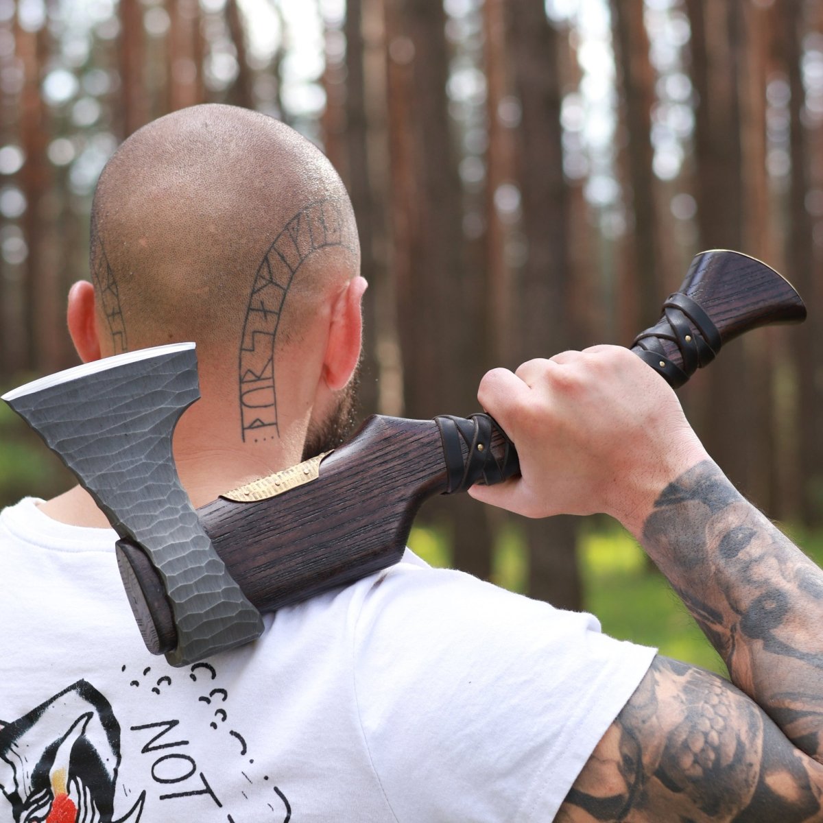 Hand Forged Viking Axe "Veles" with leather wrap on the handle from AncientSmithy