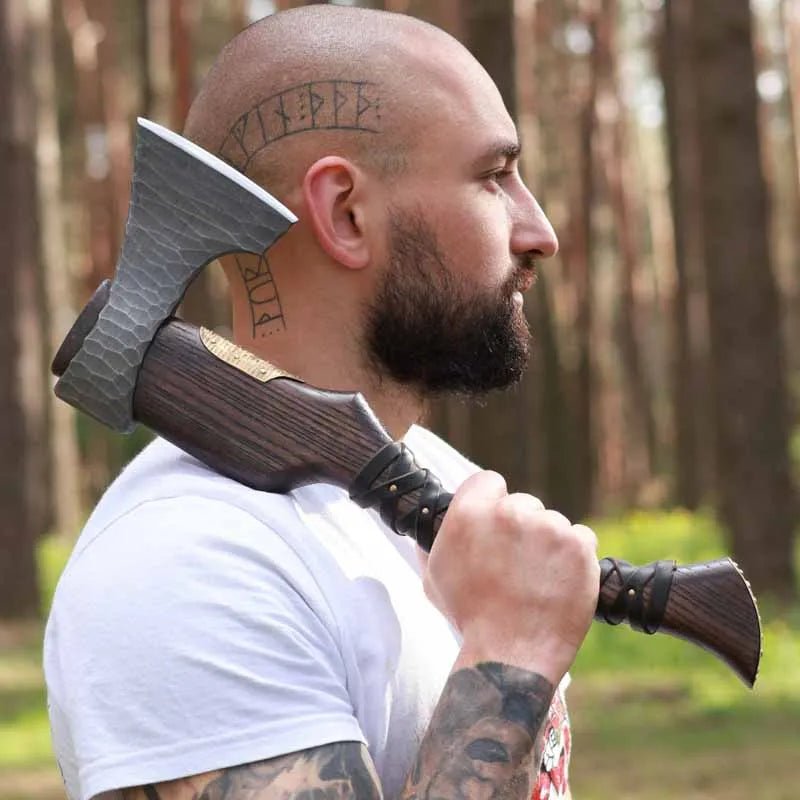 Hand Forged Viking Axe "Veles" with leather wrap on the handle from AncientSmithy