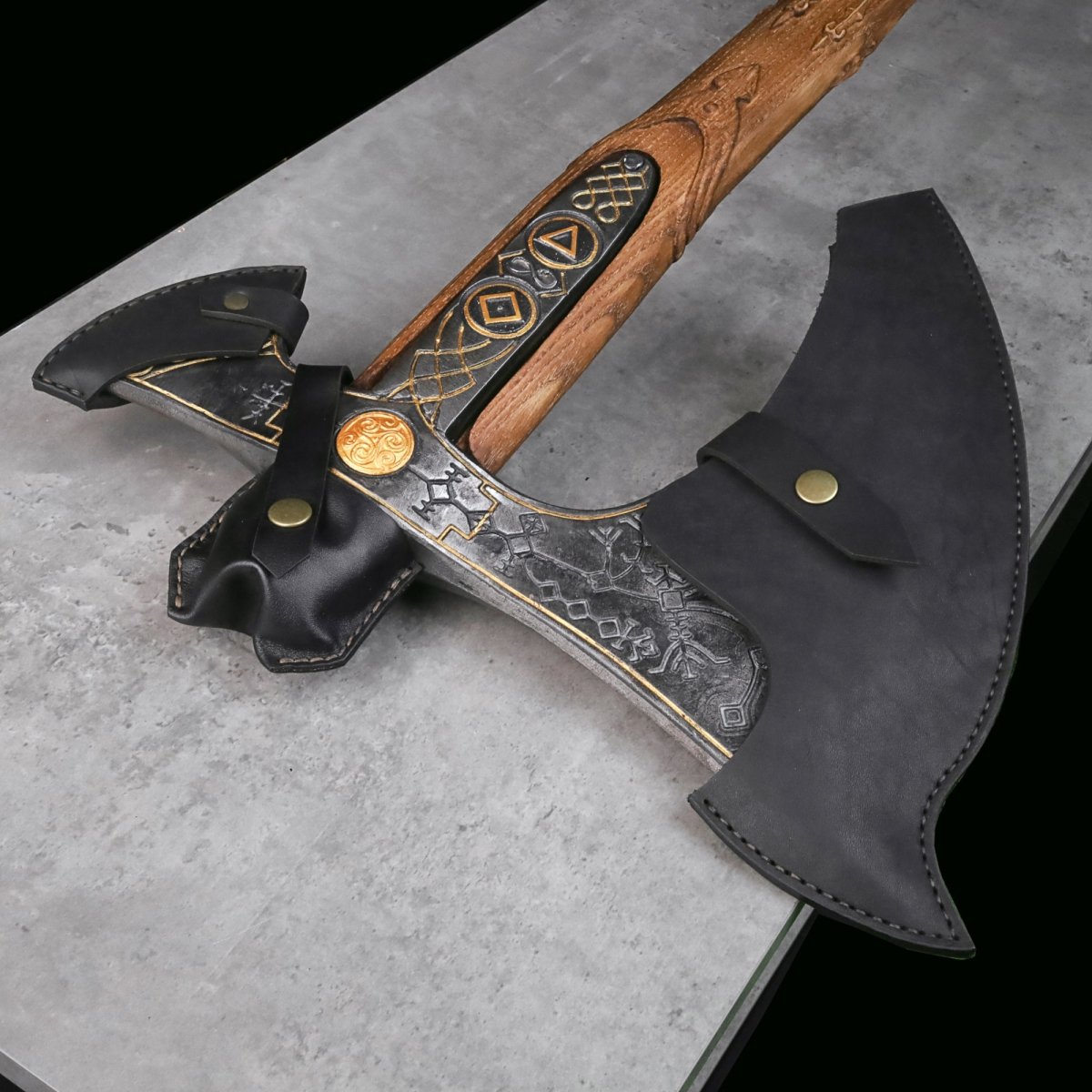 Handcrafted Leviathan axe with leather cover and glow in the dark runes from AncientSmithy