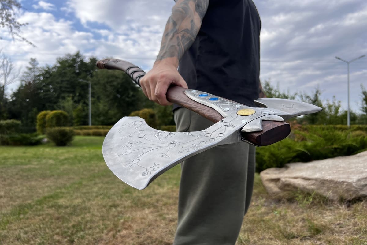 Hand-forged Leviathan axe with leather wrap from AncientSmithy