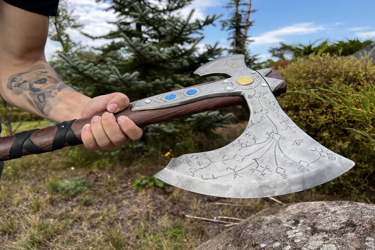 Hand-forged Leviathan axe with leather wrap from AncientSmithy